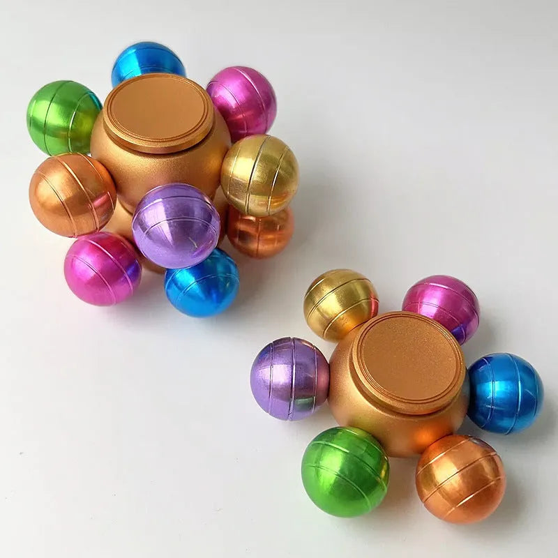 Colourful six Dragon Ball six-bead fingertip gyro in zinc alloy with metal bearing, approximately 6 x 2.2 cm
