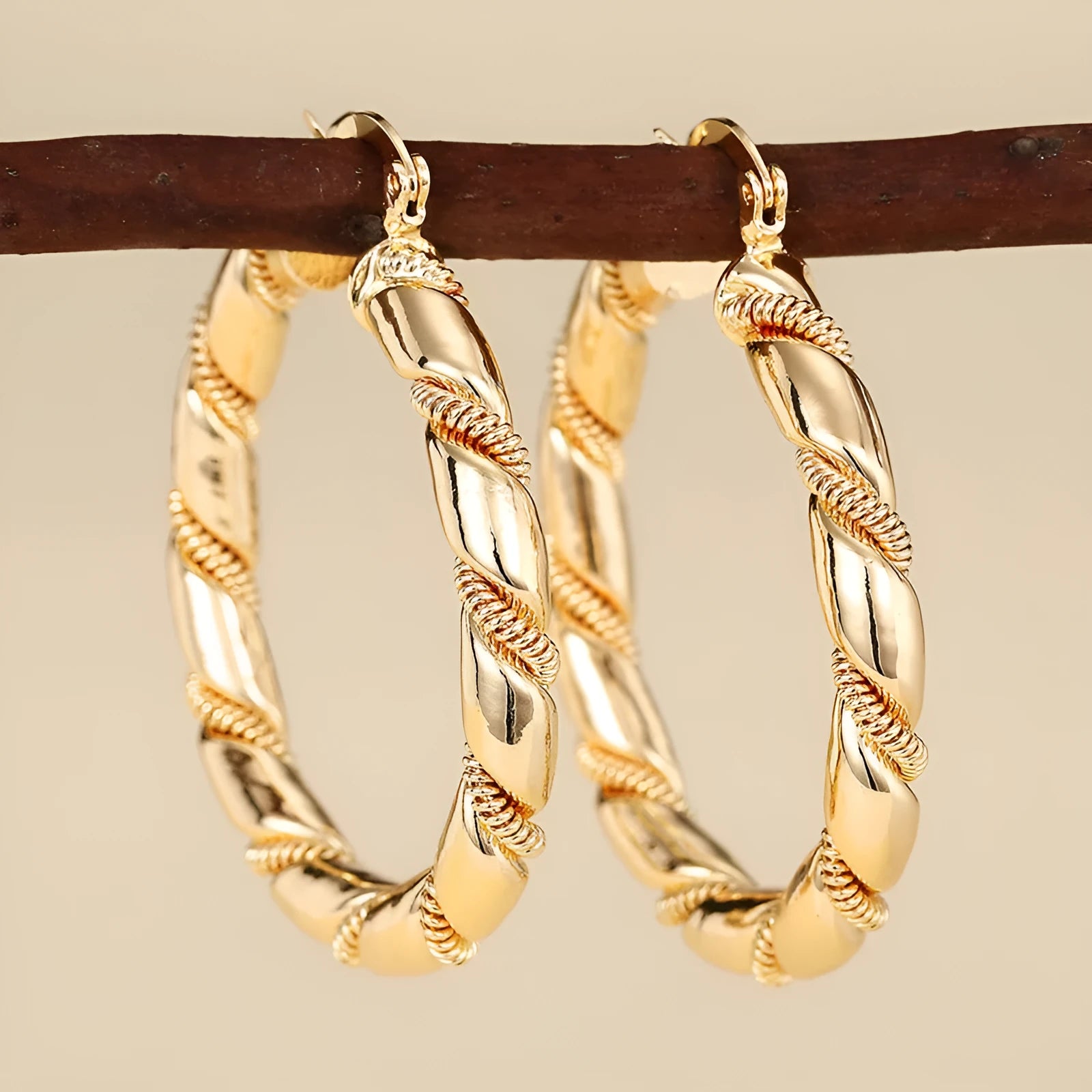 Geometric copper earrings with ring and line design elements in golden finish