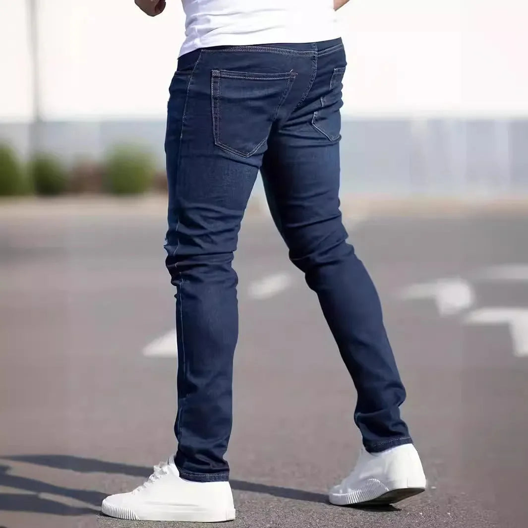 Men's dark blue slim fit cotton jeans with skinny leg opening and mid waist