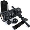 Black foam massage roller measuring 33cm with six separate massage pieces along shaft