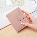 Women's short wallet in PU with lychee pattern, shown in beige, pink, black, and red colour options.