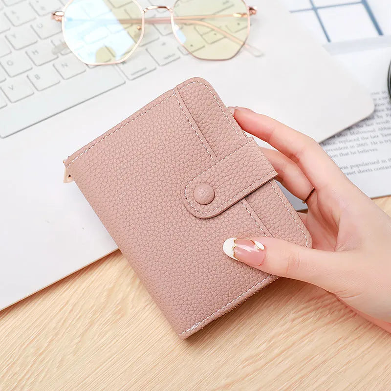 Women's short wallet in PU with lychee pattern, shown in beige, pink, black, and red colour options.