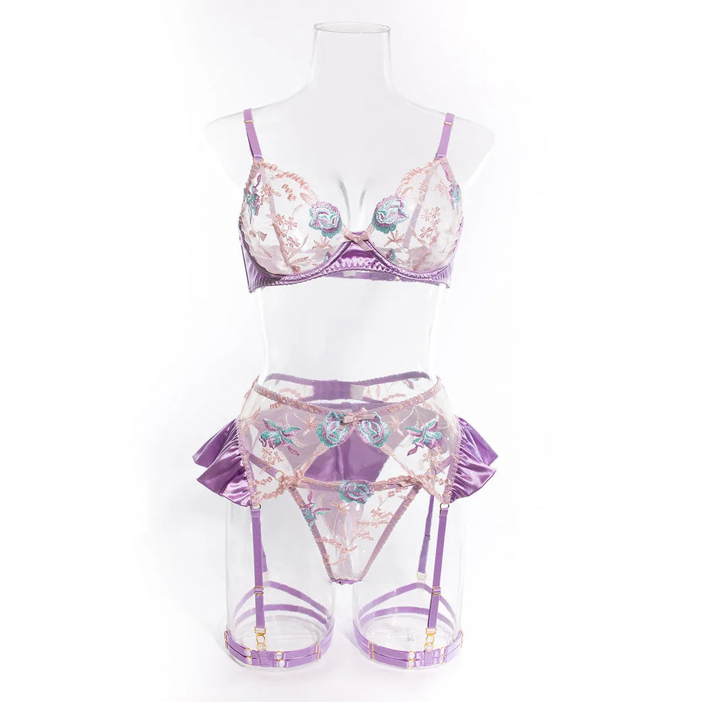 Light purple satin four-piece lingerie set with embroidery detailing shown front and back