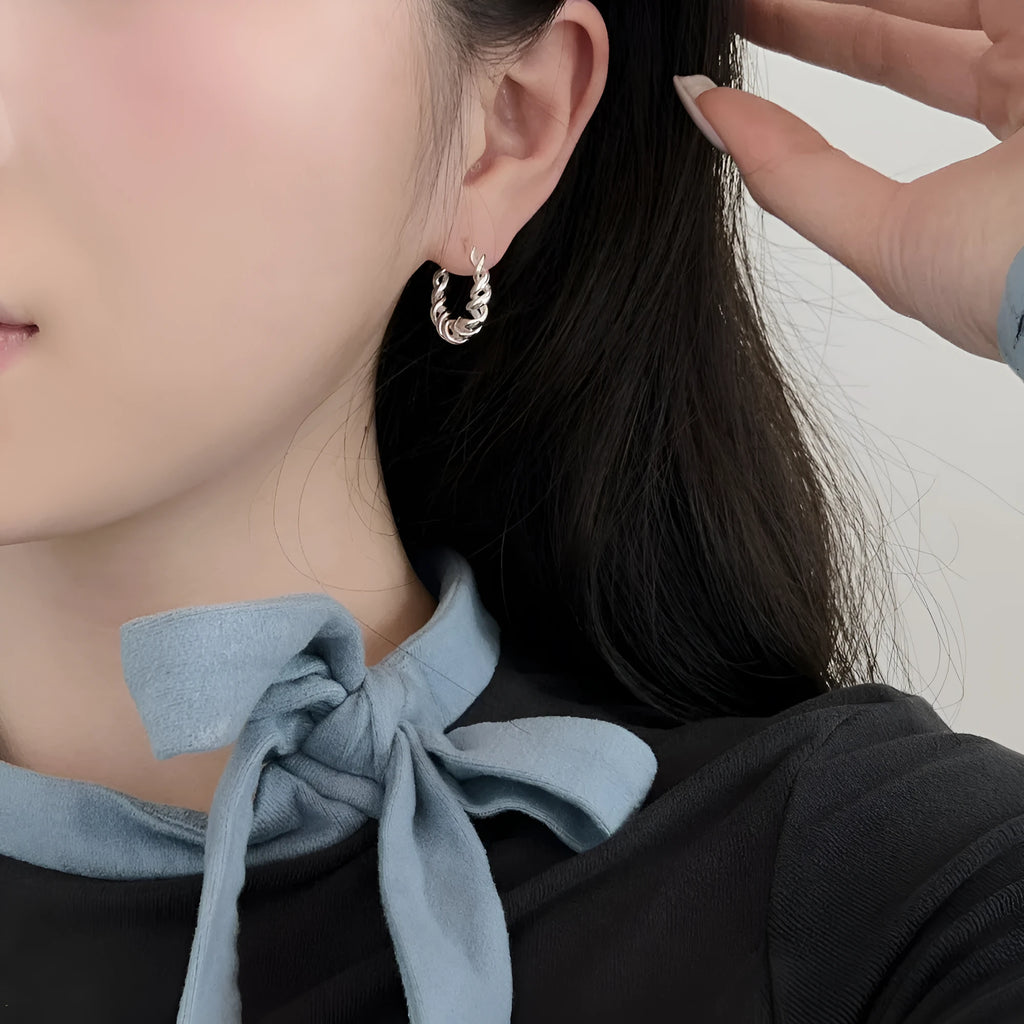 Argent Pur 925 silver ear studs with electroplated silver finish on a neutral background