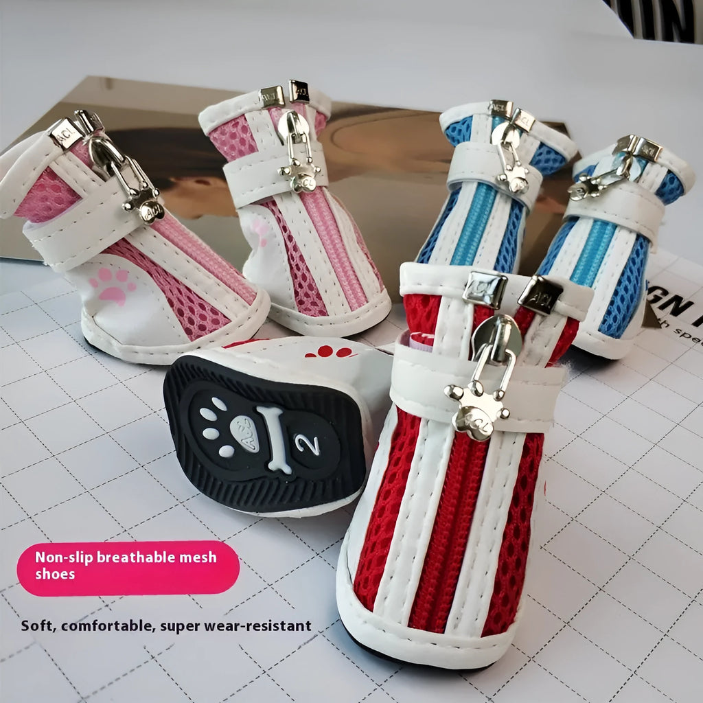 Blue zip-up cloth dog shoes with non-slip soles from a four-pair pack.