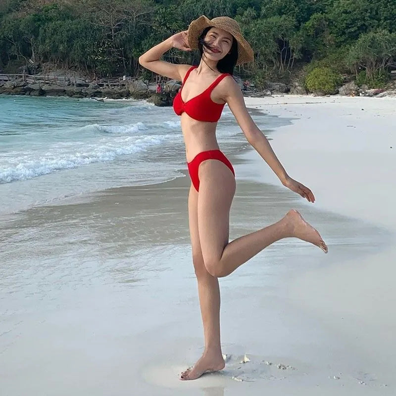 Women's red split bikini swimsuit made from polyester fibre, available in sizes S M L, sleeveless design for summer vacations