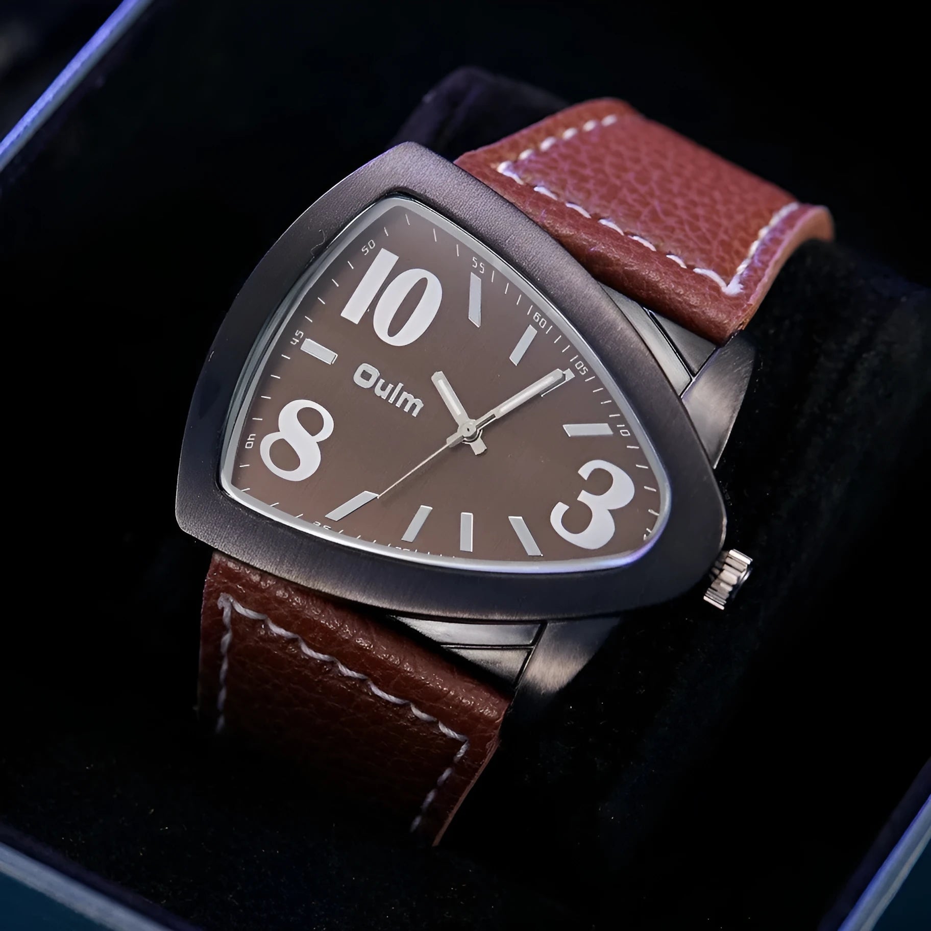 Men's casual analogue watch with triangle pattern band, shown in brown, black, and blue colour options.