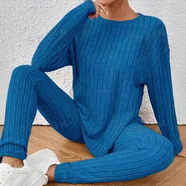 Black sunken stripe two-piece homewear set with pants and regular sleeve top on hanger