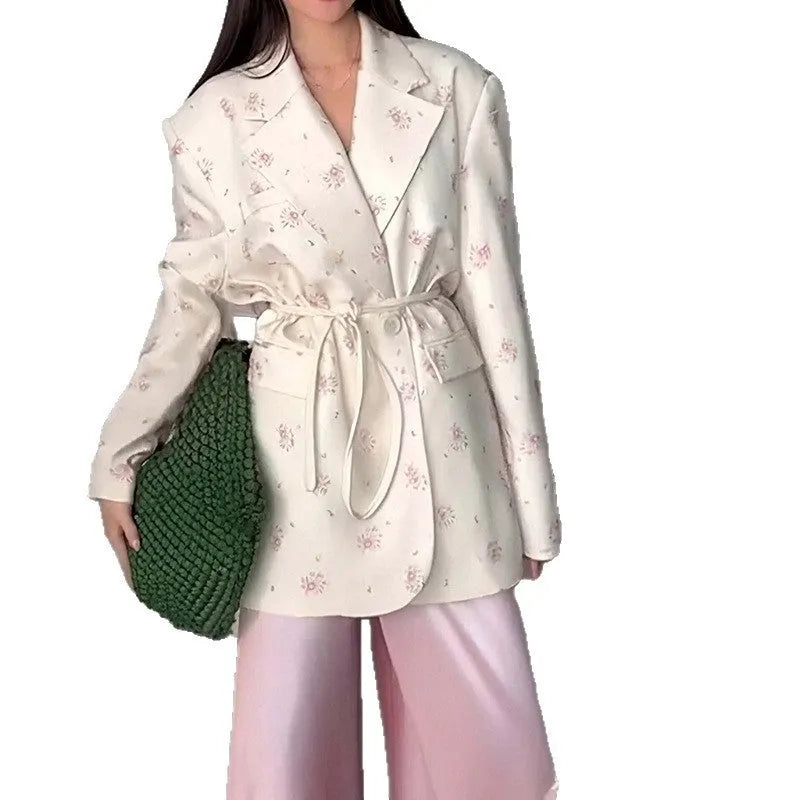 Women's white suit jacket with lace-up waist detail and collar, shown in regular fit with long sleeves