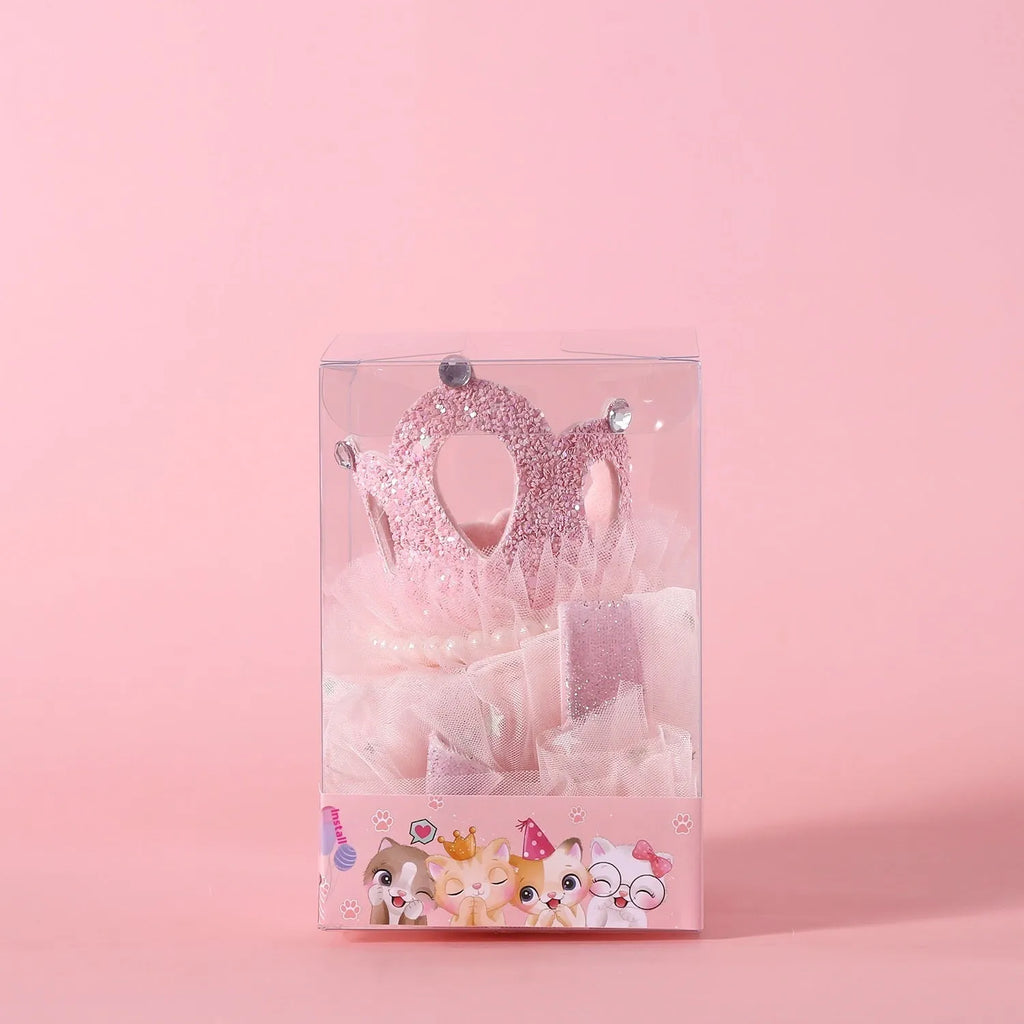 Beige and pink princess crown headdress with veil for cats on a plain background.