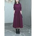 Purplish red women's long sleeve midi dress for winter, shown in a plus size.