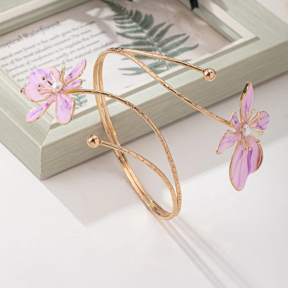 Alloy hollow armband with fashion pattern designs in pink or purple colour options