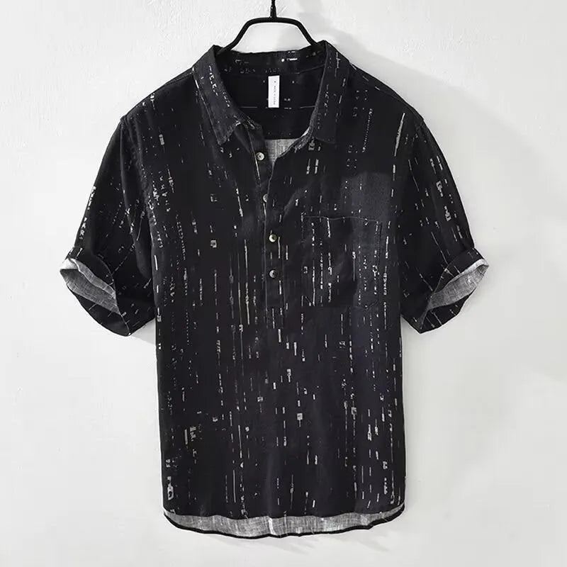 Men's black loose-fit short-sleeved polo shirt with a lapel collar on a hanger.