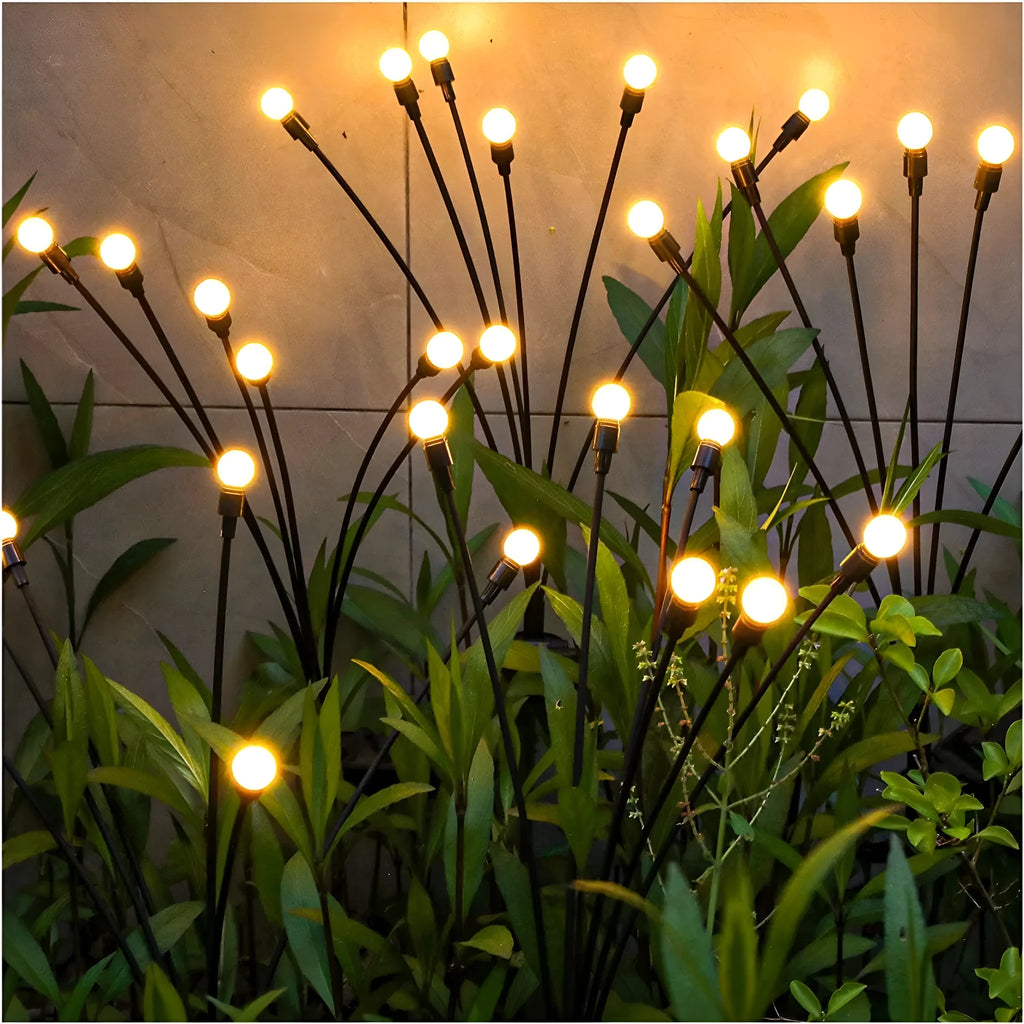 Solar-powered LED ground spike lamp with multiple light heads for garden pathway lighting