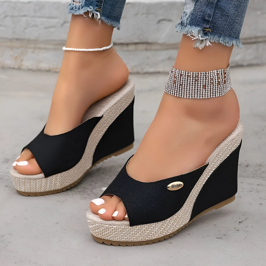 Women's black wedge sandals with buckle details, first layer cowhide upper, leather lining, and cloth sole on white background