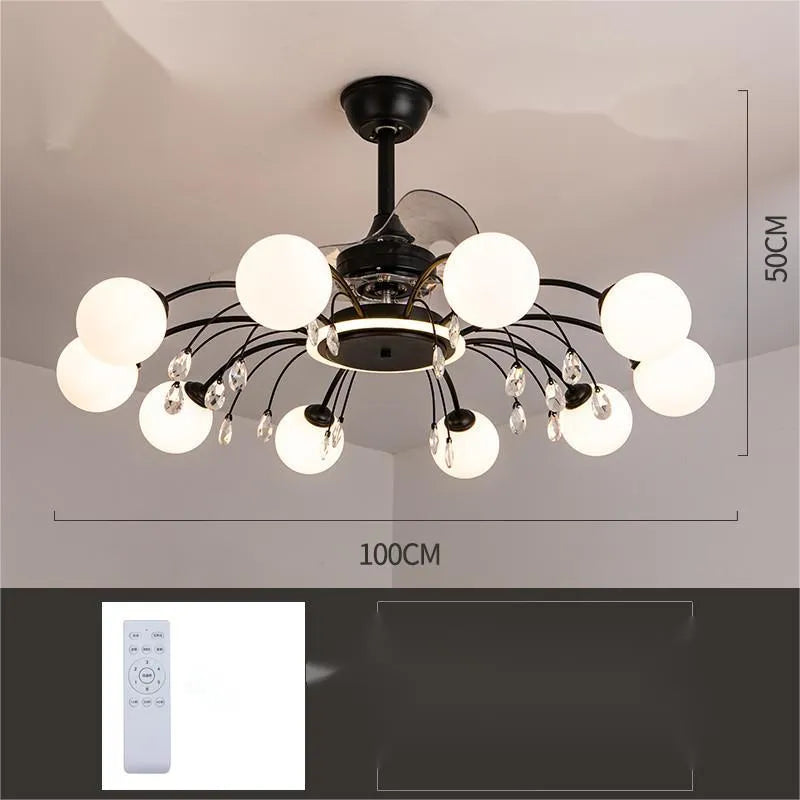 Black and gold ceiling fan light fixture with acrylic shade and metal blades, shown with remote control