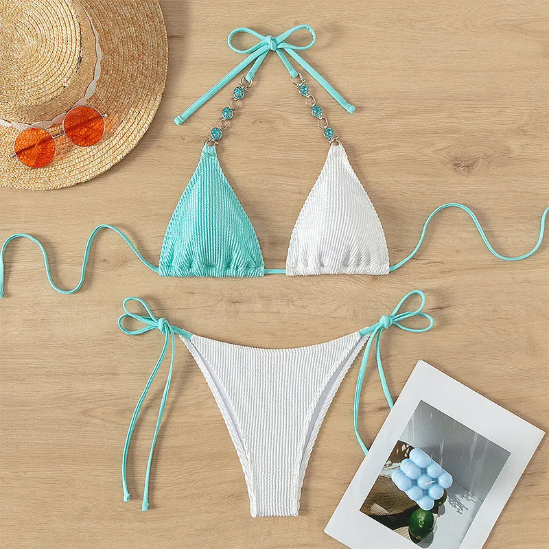 Women's colour-matching swimsuit with lace-up design and pearl chain detailing on nylon fabric