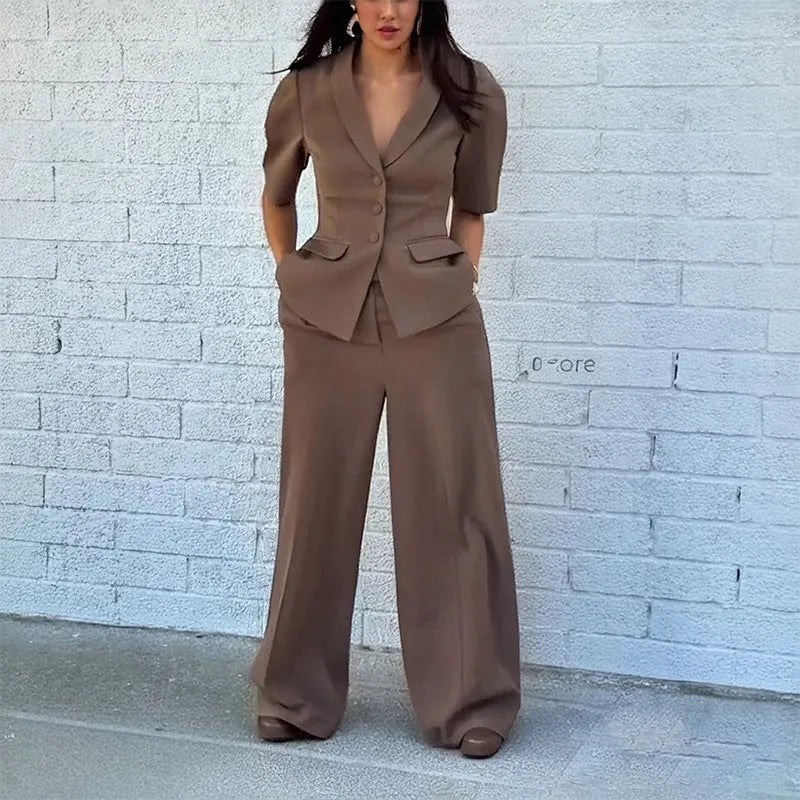 Brown men's two-piece polyester suit with a slim fit waist, shown on a hanger.