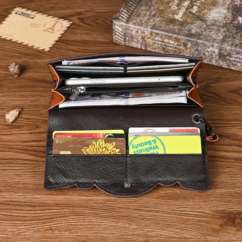 Women's tri-fold wallet with embossed floral pattern in retro brown colour, showing organisational compartments
