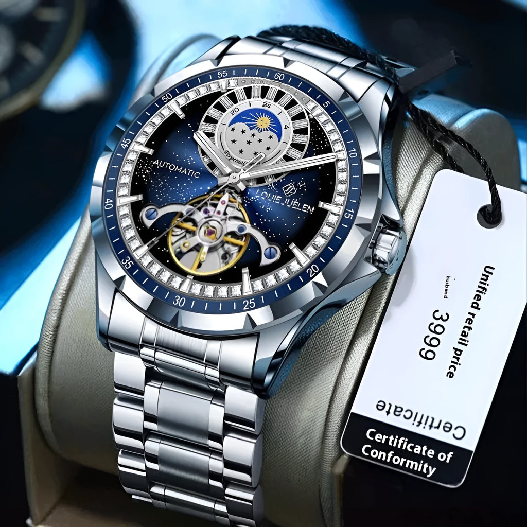 Silver automatic mechanical watch with blue dial and stainless steel bracelet on wrist