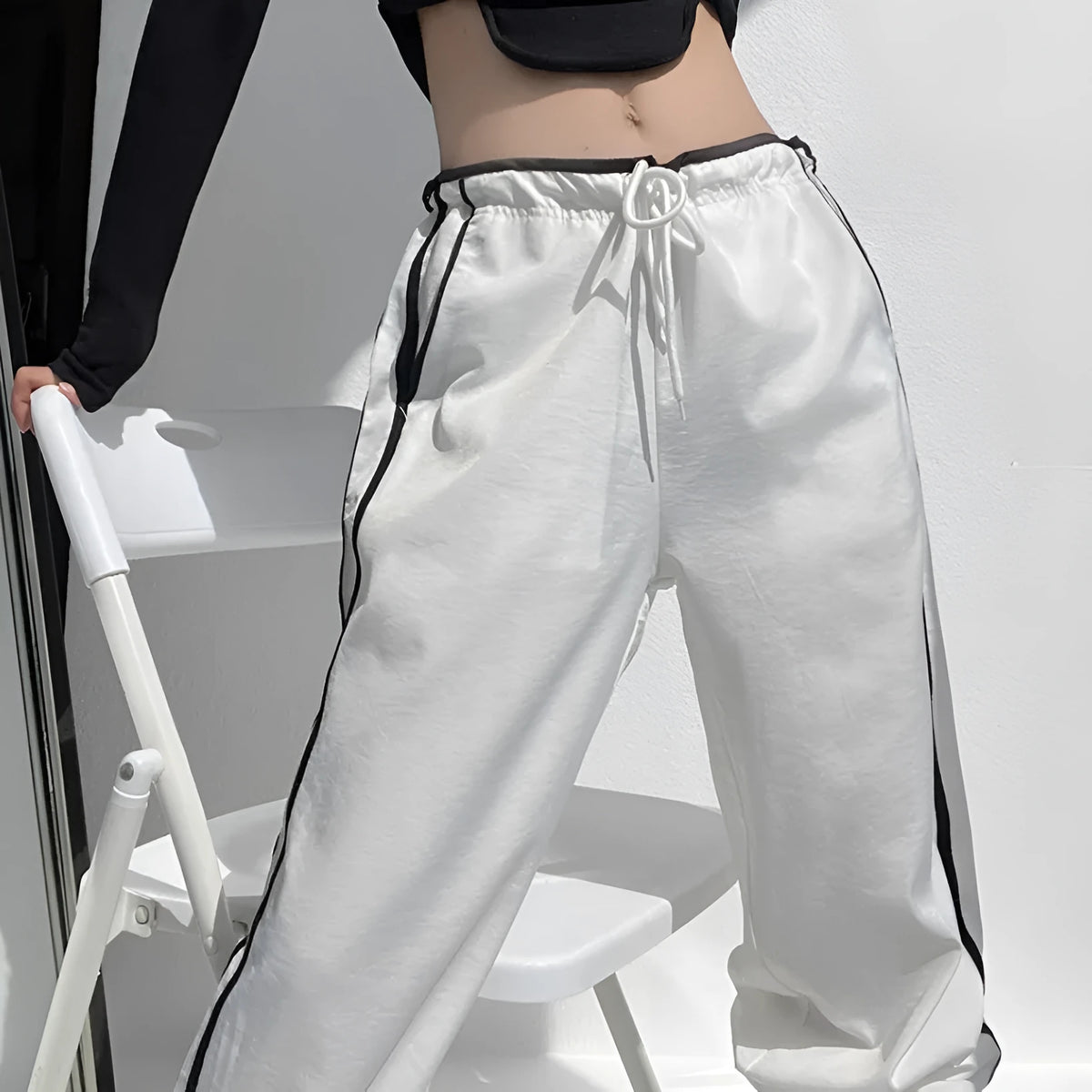Women's loose straight trousers with ribbon parallel bars detailing in thin draping fabric