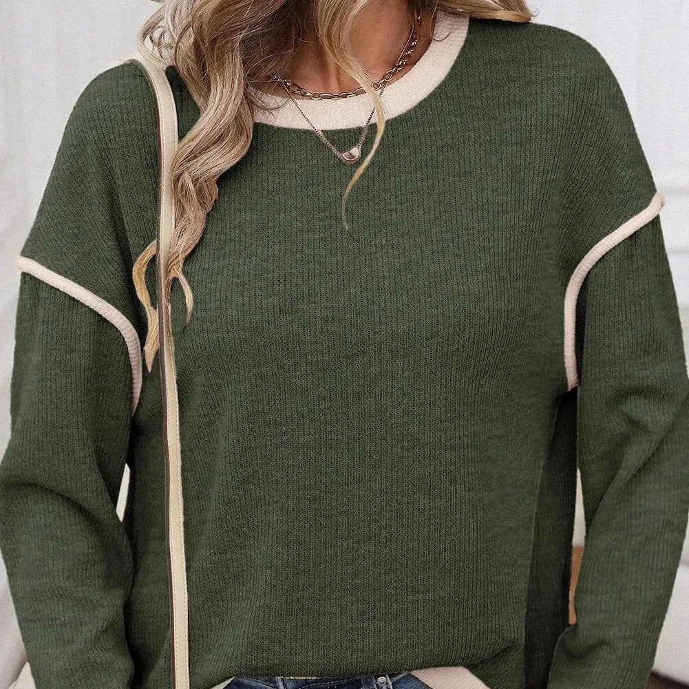 Women's loose-fit knit top with drop shoulders and four leaf clover pattern contrast trim