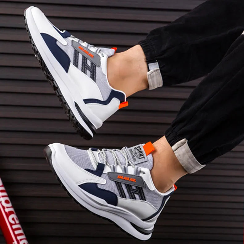 Men's sports sneakers in light grey or black with PU and mesh upper, front tie fastening, plastic sole, sizes 39-44