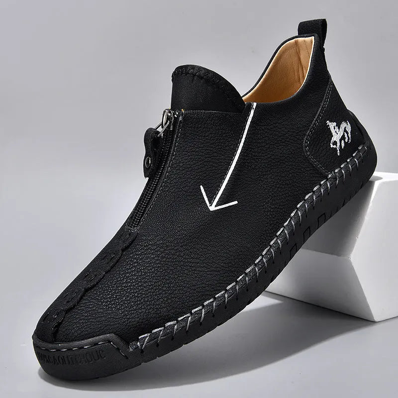Men's black leather martin boots with front zipper and round toe design on rubber sole