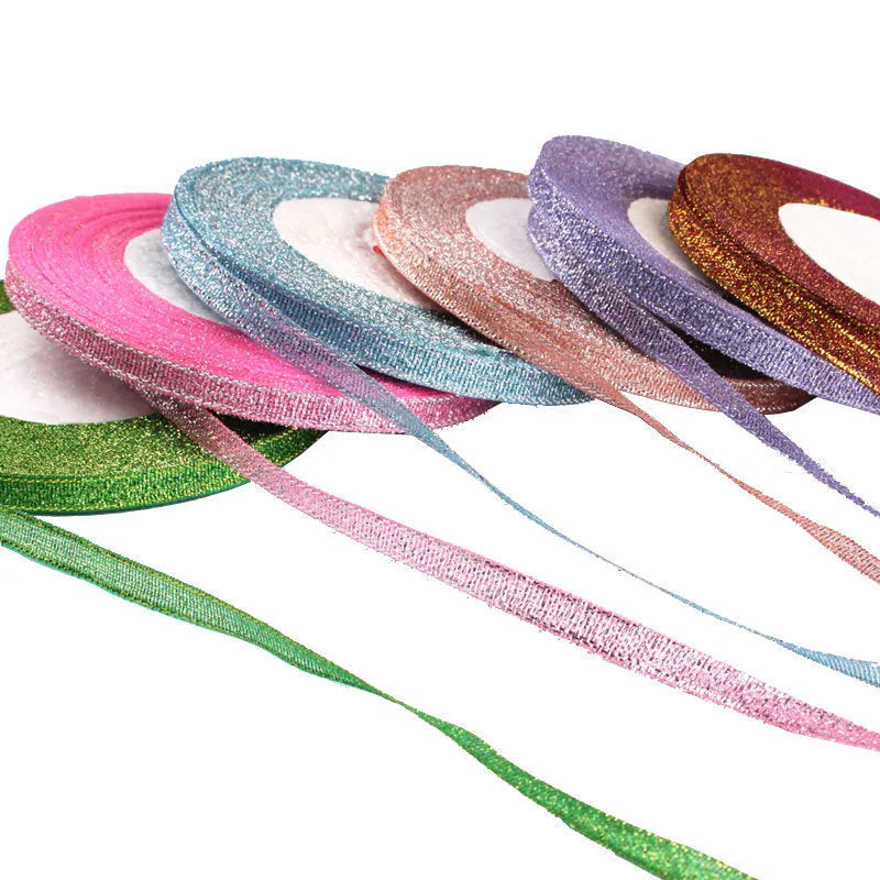 Polyester ribbon roll in various colours including gold leaf and silver, showing 0.6cm width and 22 metre length
