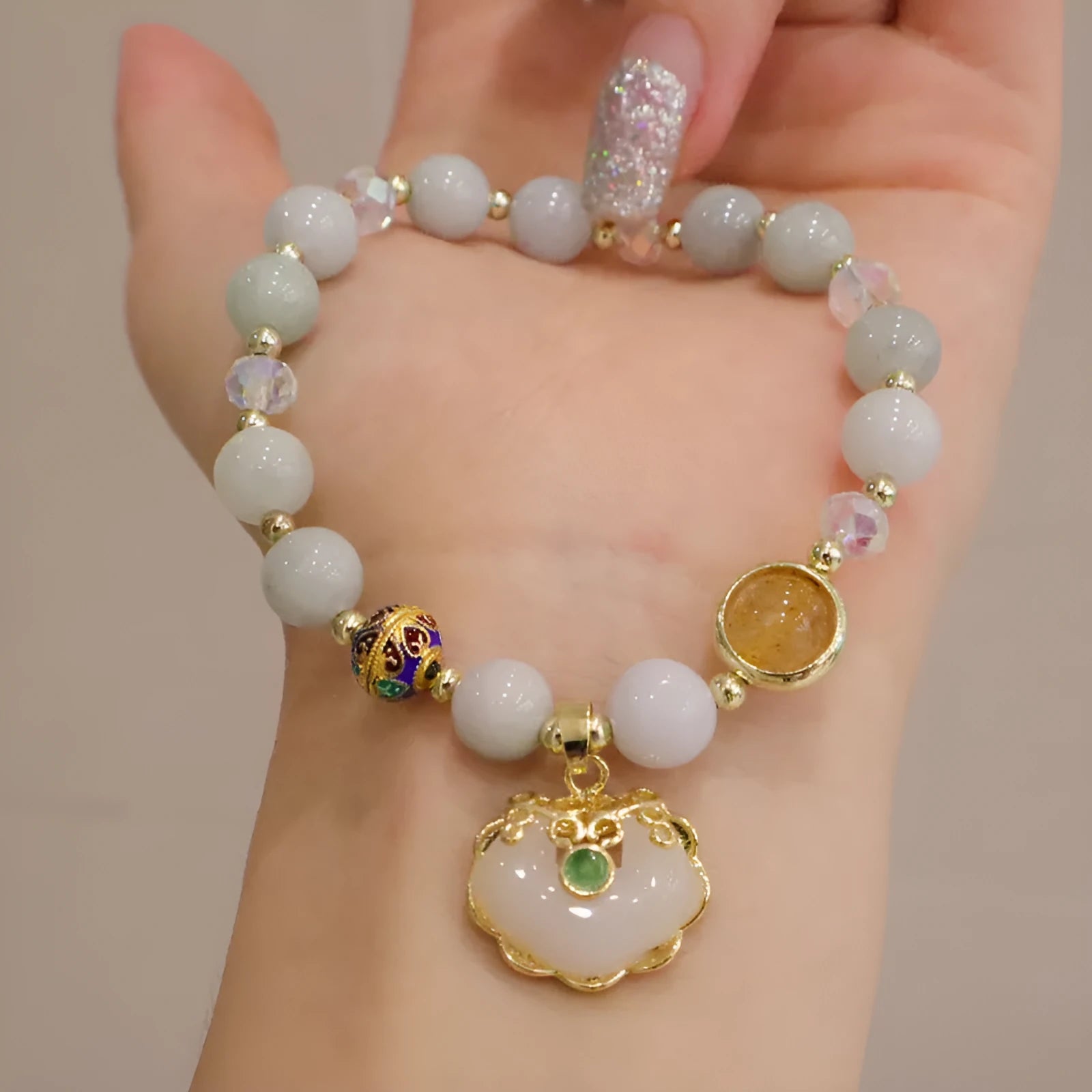 Geometric women's bracelet with grey jade and strawberry quartz stones and metal accents