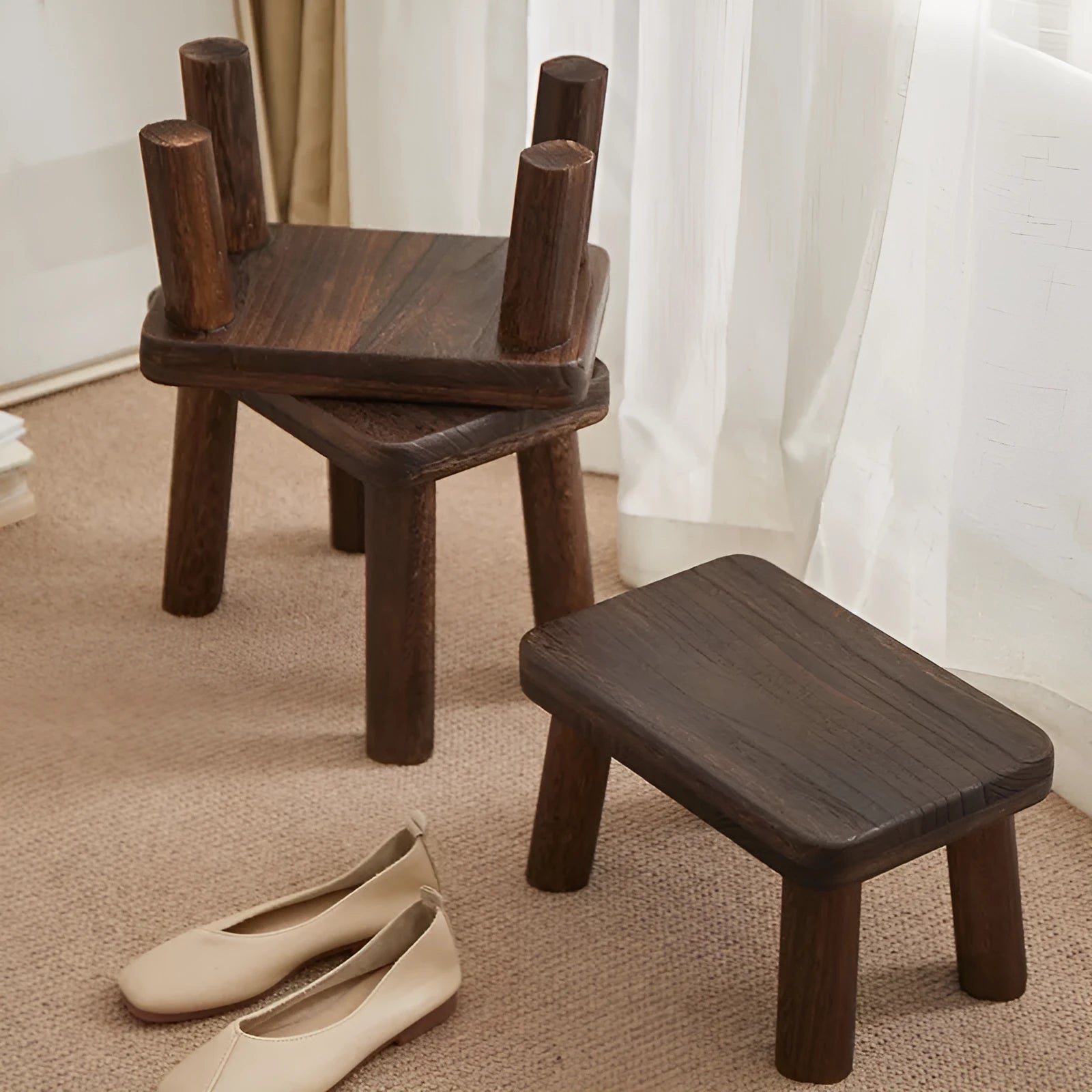 Distressed finish wooden shoes changing stool with bracket construction legs.