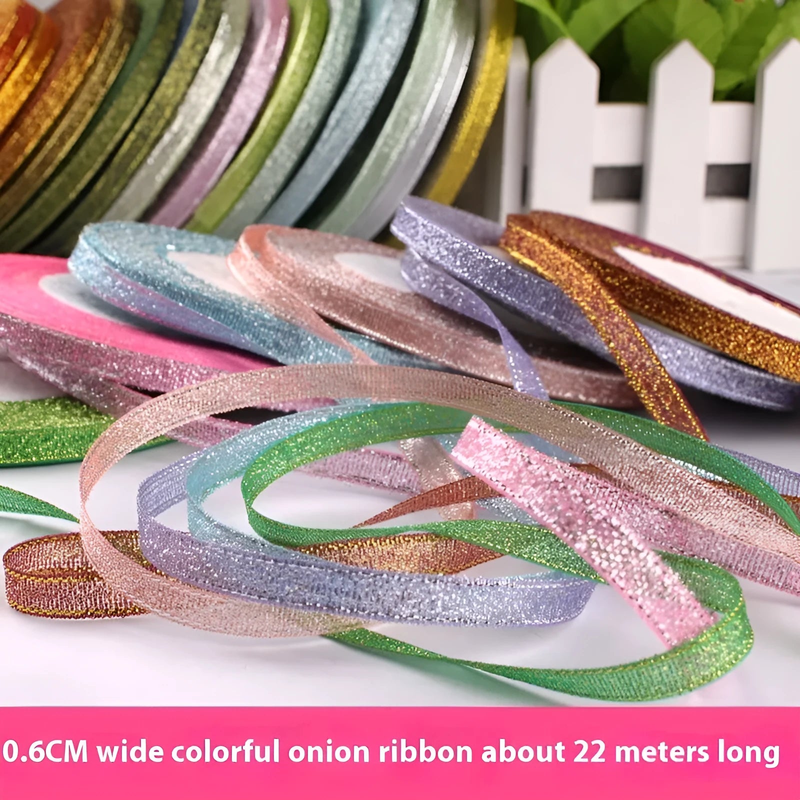 Polyester ribbon roll in various colours including gold leaf and silver, showing 0.6cm width and 22 metre length