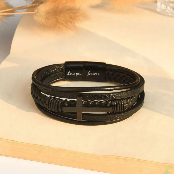 Men's stainless steel cross bracelet with leather band and plated finish, shown in steel and black colour options