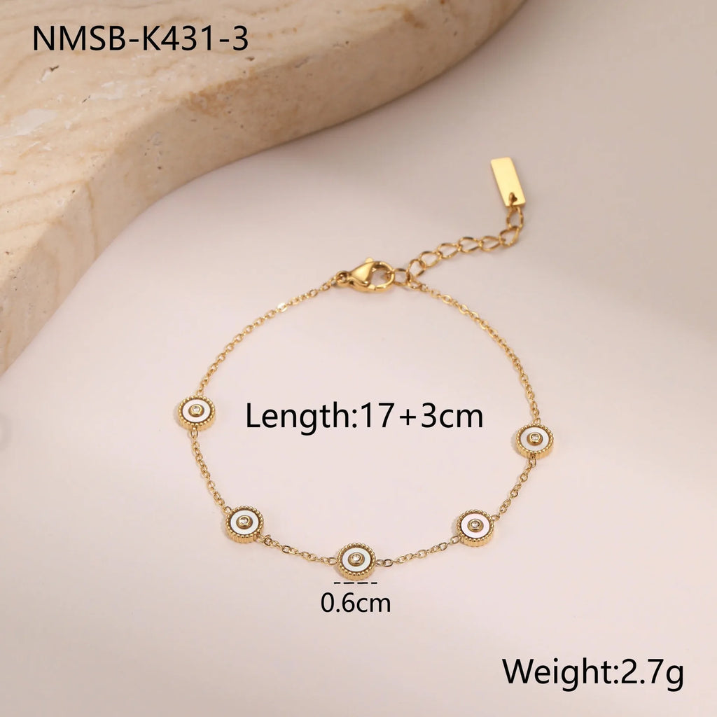 Stainless steel bracelet with 18K gold electroplating and geometric fritillary design, shown with matching necklace