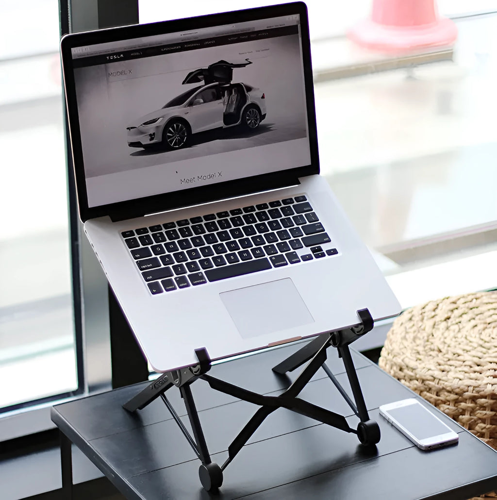 Black folding portable laptop stand showing reinforced nylon construction and compact folded dimensions