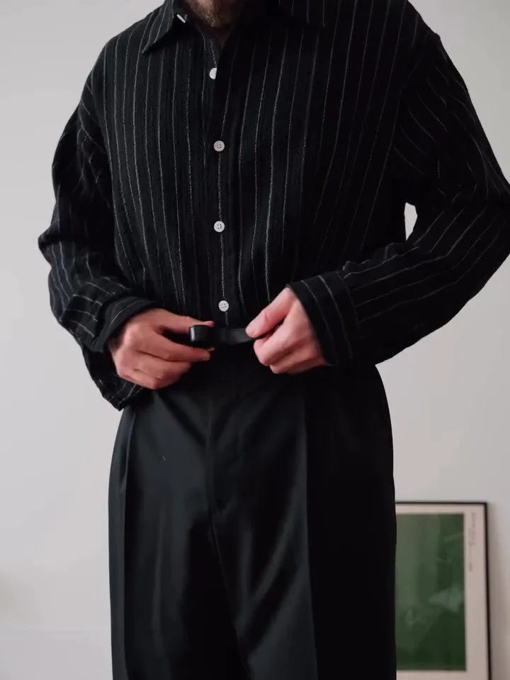 Black pinstriped button-down shirt with regular fit and traditional collar on mannequin