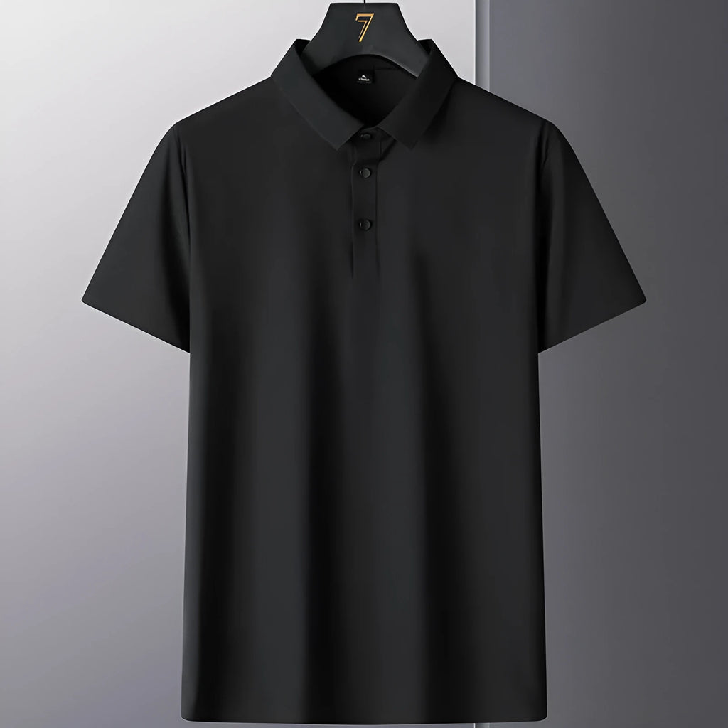 Man wearing a solid colour short sleeve non-iron business casual shirt in a professional setting.