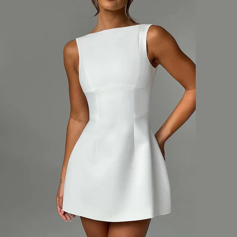 Woman wearing a sleeveless high-waist backless mini dress in black polyester fabric