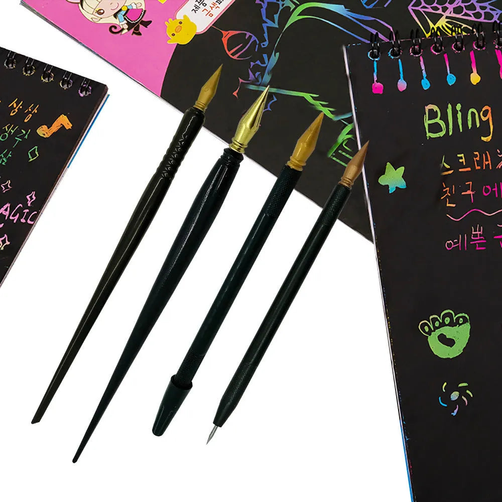 A white scratch art pen with a black brush tip on a wooden surface.