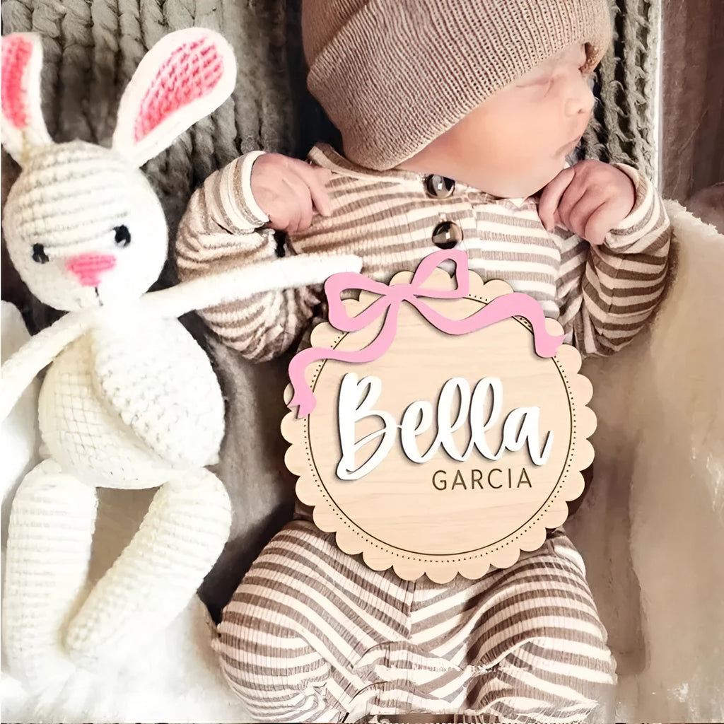Square wooden baby room decoration ornament with a personalised name engraved in the centre.