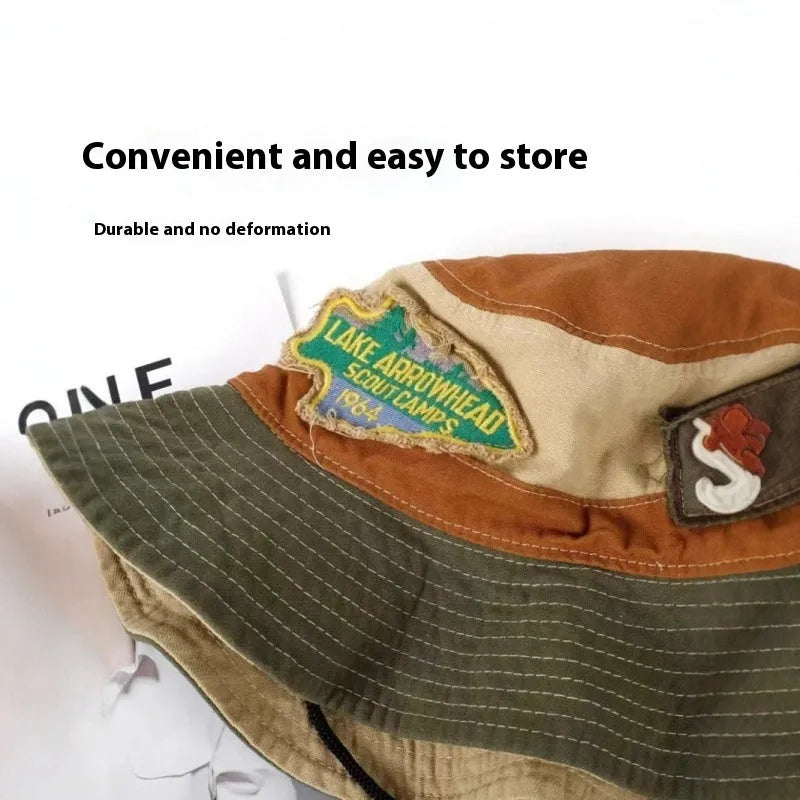 Army green cotton fisherman hat with retro patchwork details and flat top crown for summer sun protection