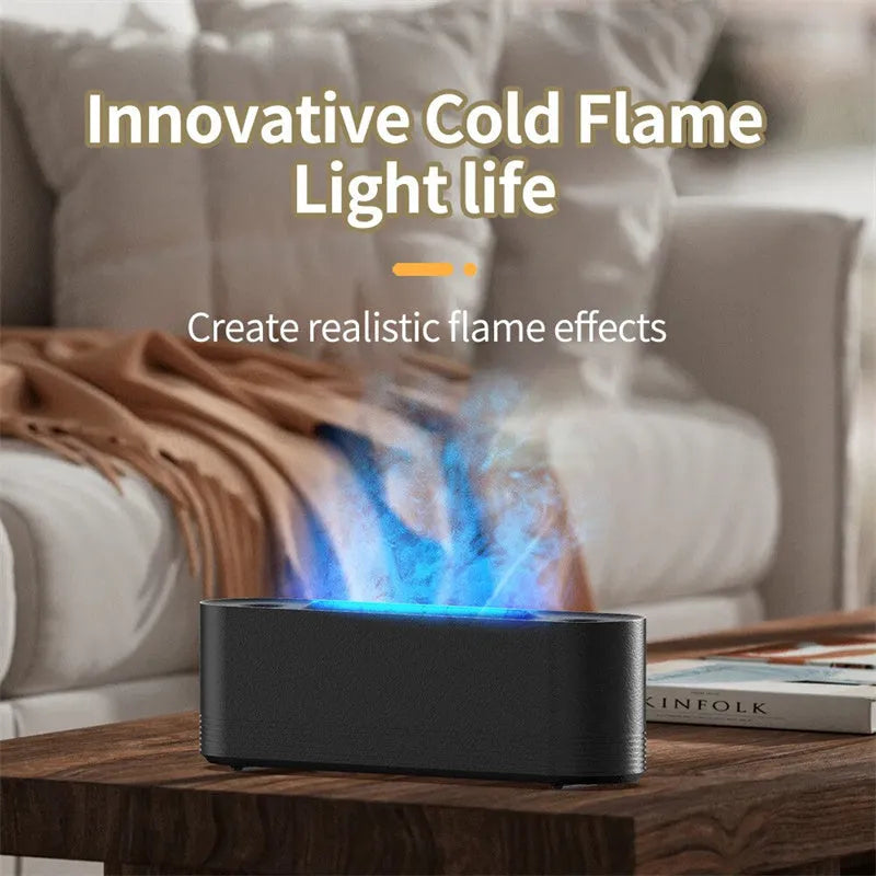 Tall black ultrasonic aroma diffuser with coloured flame LED light and rising water mist on a desk.