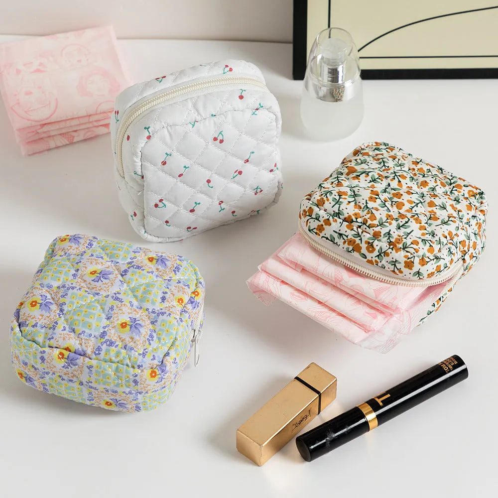 Polyester women's key storage bag with floral pattern choices on white background.