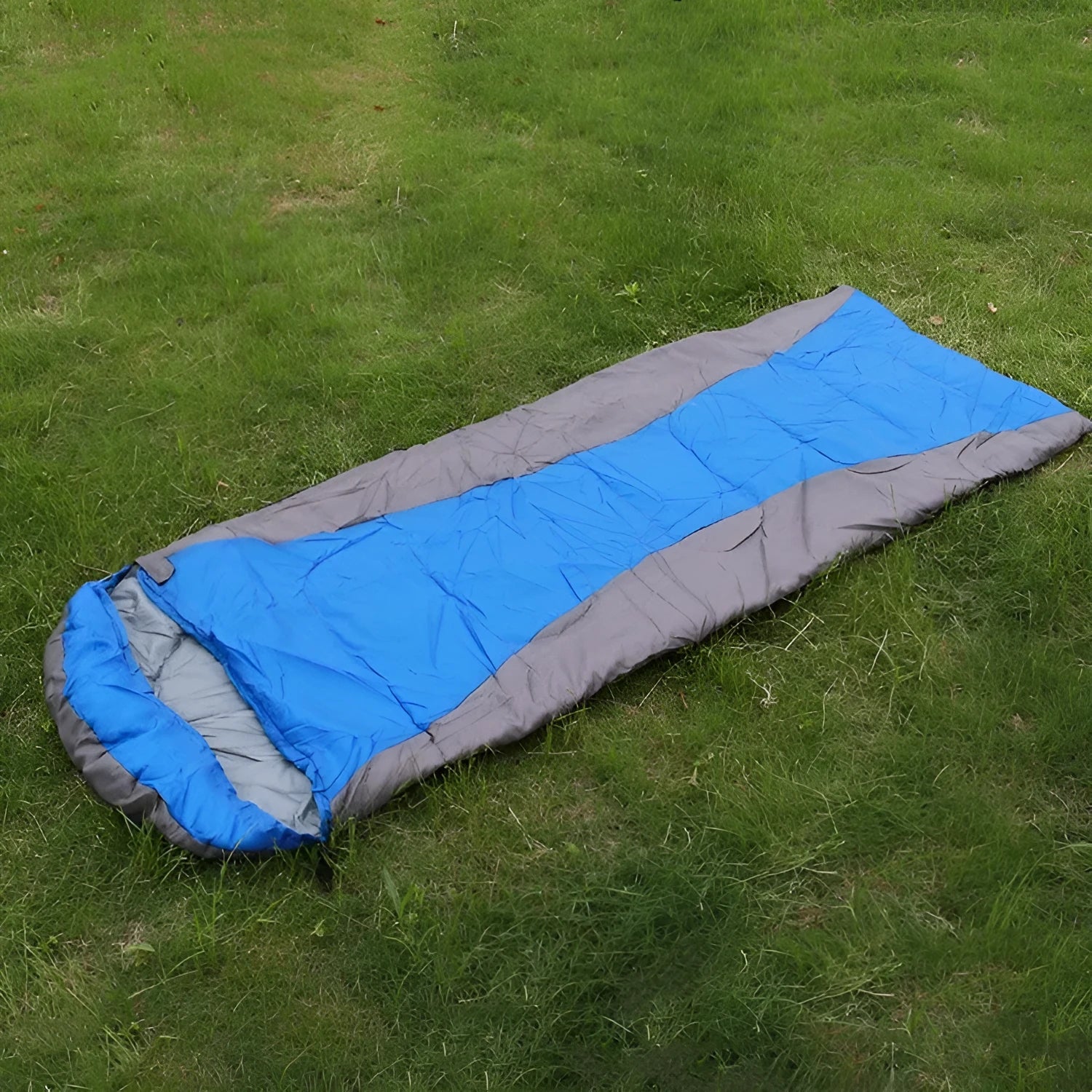 Envelope sleeping bag in orange and gray colour for camping and outdoor travel