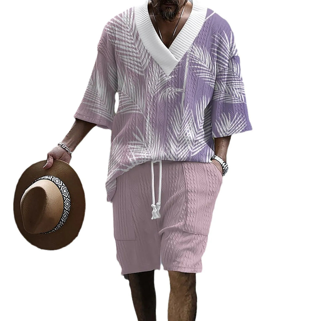 Man wearing a printed drop-shoulder knitted short sleeve top with matching shorts, a casual two-piece loungewear set.