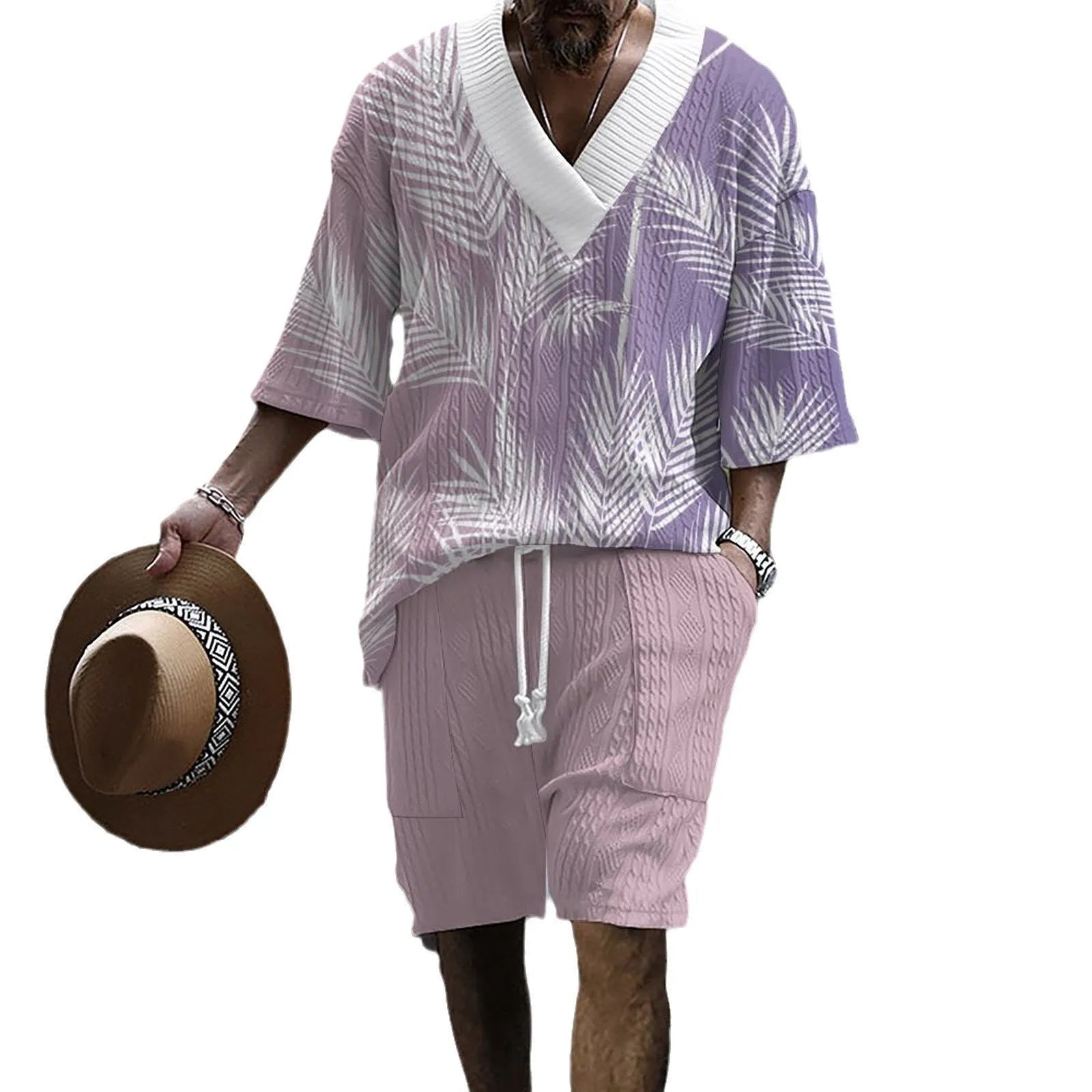 Man wearing a printed drop-shoulder knitted short sleeve top with matching shorts, a casual two-piece loungewear set.
