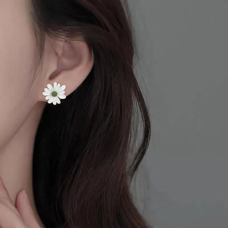 Flower-shaped alloy stud earrings in three colour combinations: blue-orange, white-green, and yellow-white