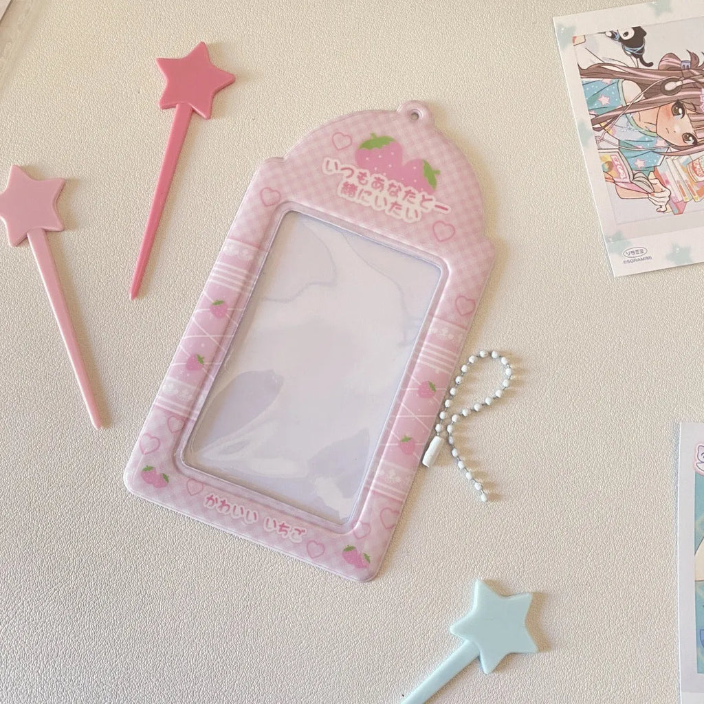 Transparent PVC card holder with cartoon strawberry or four-leaf clover design, measuring 7.6 by 13.6 cm.