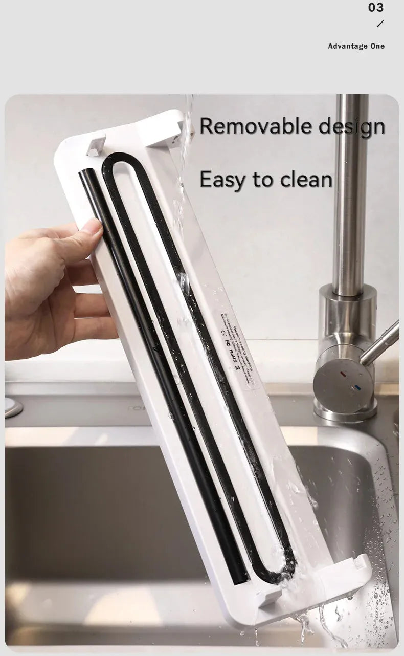 Small white automatic vacuum sealer machine for household food preservation and item protection