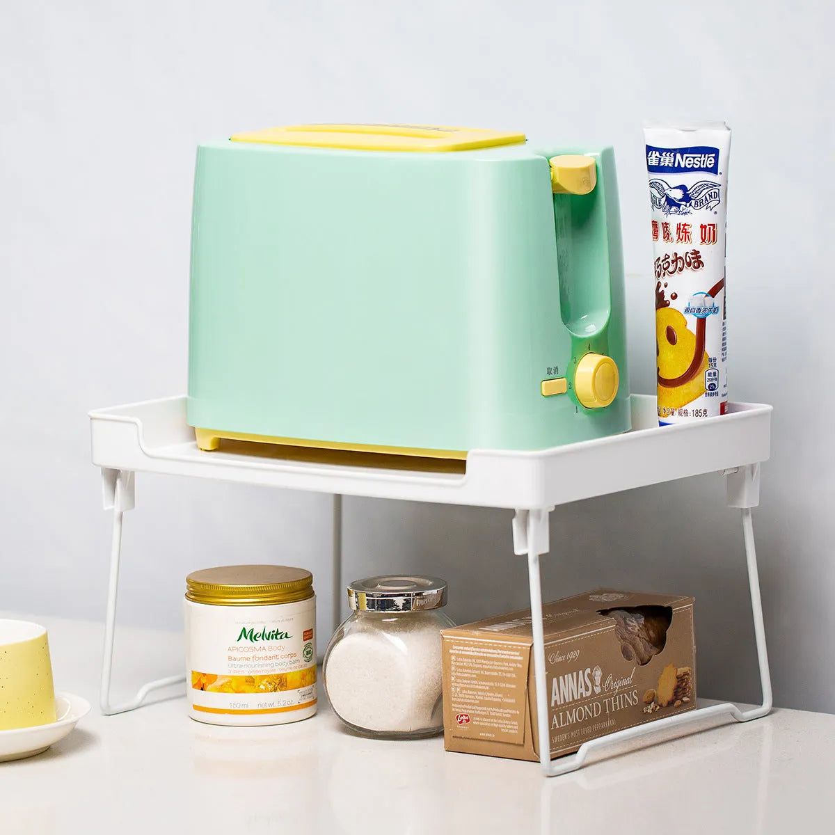 Plastic kitchen supplies rack in transparent or white colour with compartment storage design